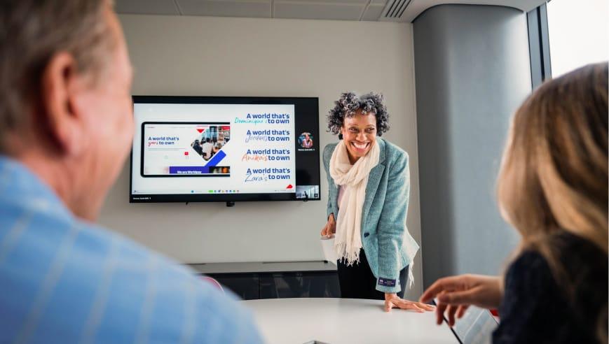 Women presenting in front of a screen