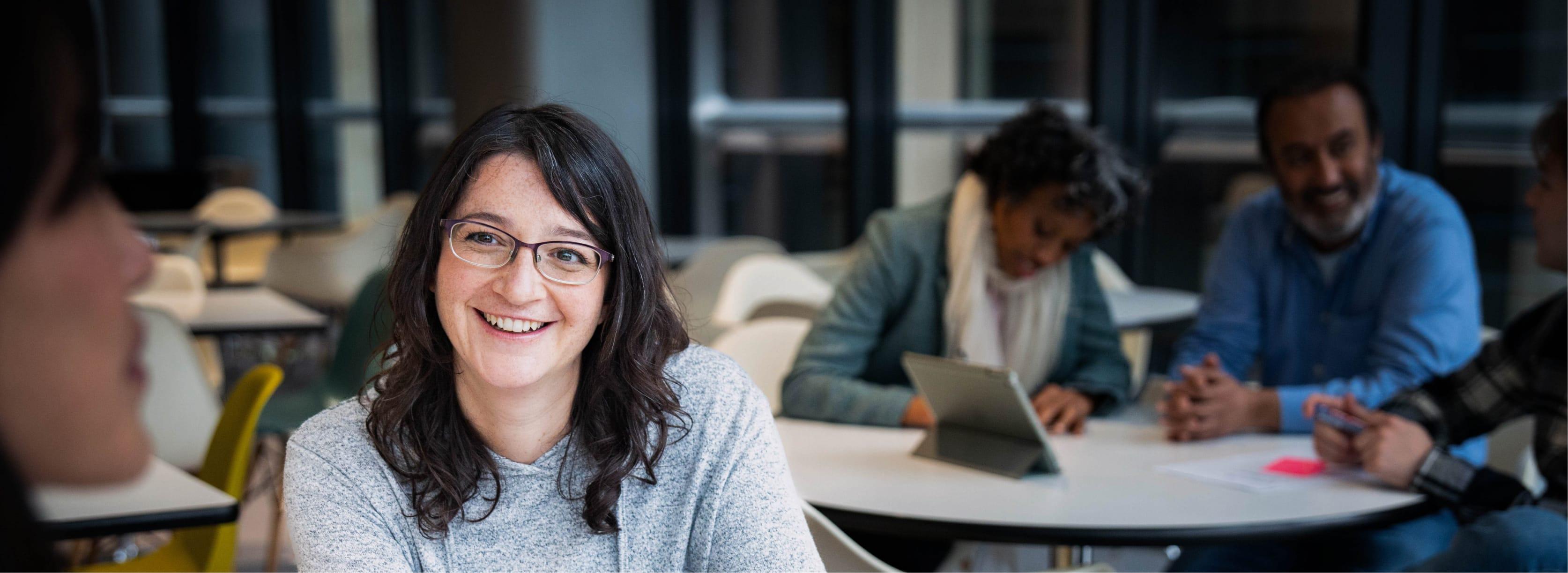 Focus shot of a women in a busy office.