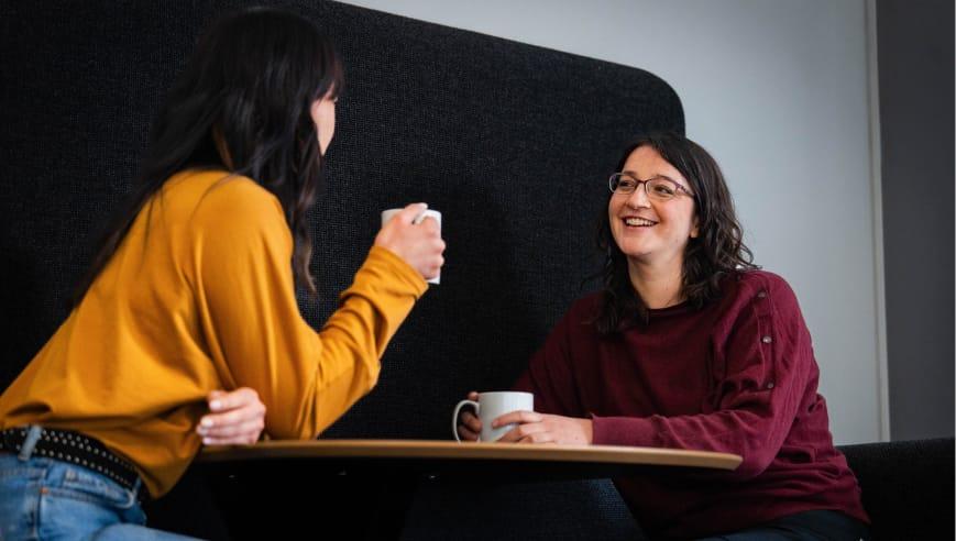 Two women smiling in an office