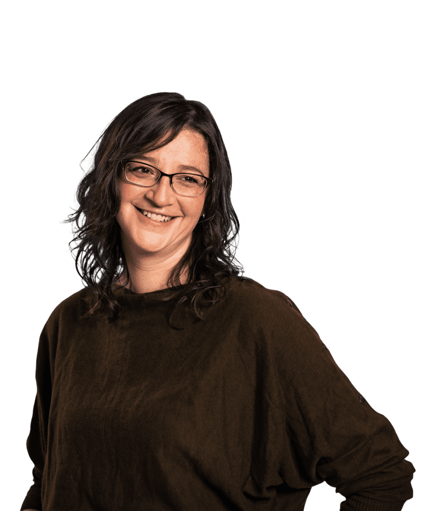 A brunette woman in glasses smiles to the side of the camera with a slight head tilt. The image of her is cut out and placed on top of an orange rectangle in the background.