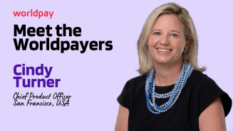 Lilac square with text that says ‘Meet the Worldpayers. Cindy Turner, Chief Product Officer. San Francisco, USA’. Next to the text is headshot of a woman with blue beaded necklaces.