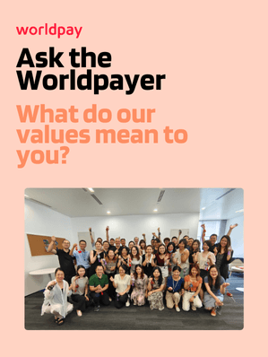 Orange background with a group photo and text reading "What do our values mean to you?"