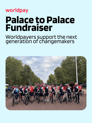 Worldpay employees on bicycles in front of a blue background with text "Palace to Palace Fundraiser"