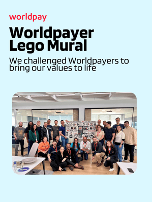 Group of Worldpay employees with Lego Mural in the office