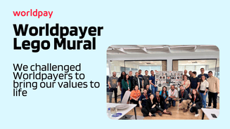 Group of Worldpay employees with Lego Mural in the office