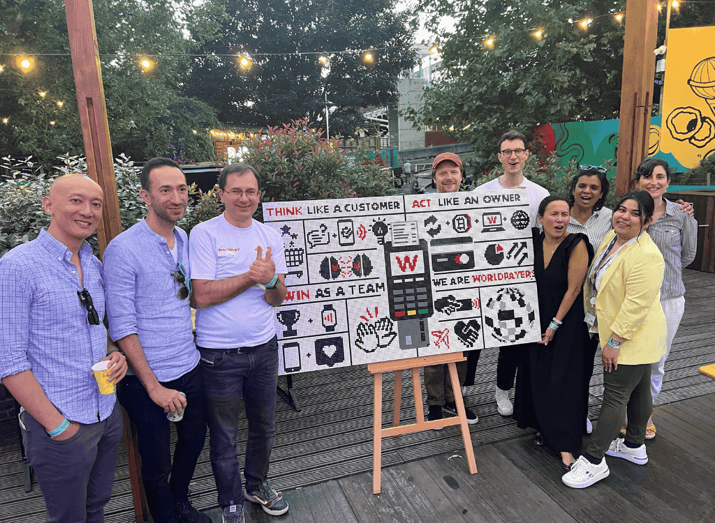 London Worldpayers in a group photo with their lego wall