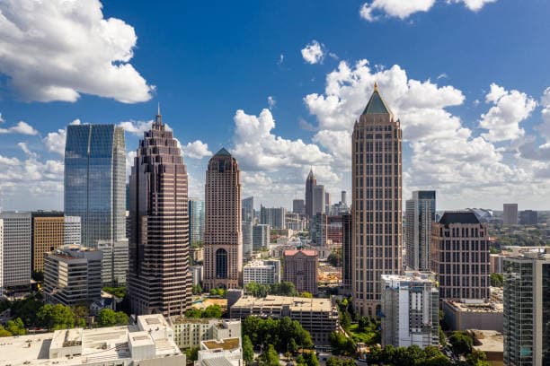 Atlanta skyline with puffy clouds and blue sky